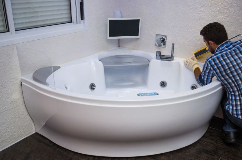 Refinishing technician preparing a bathtub